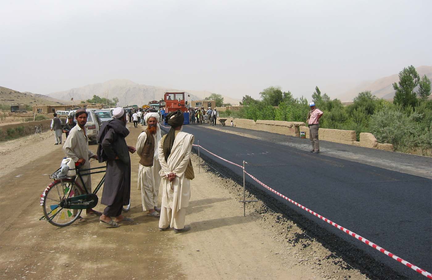 Men_watching_road_work_on_Kabul-Kandahar_Highway_in_2003